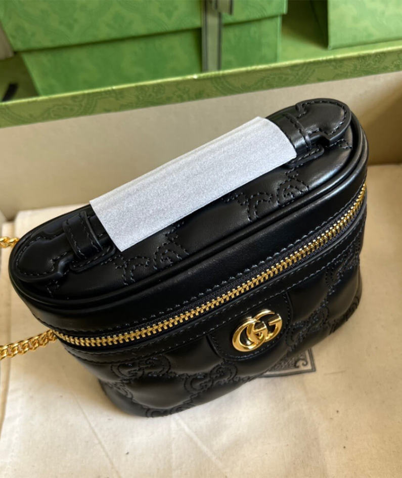 GG Matelassé top handle mini bag