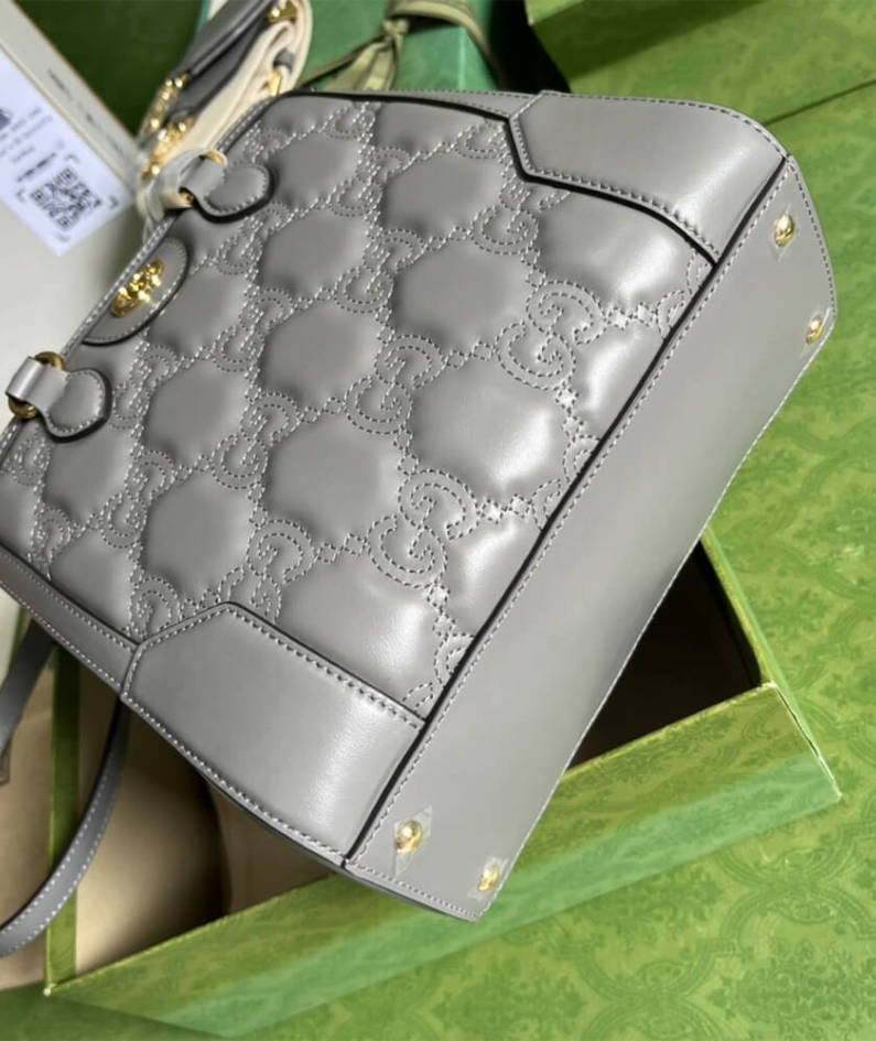 GG matelassé mini top handle bag