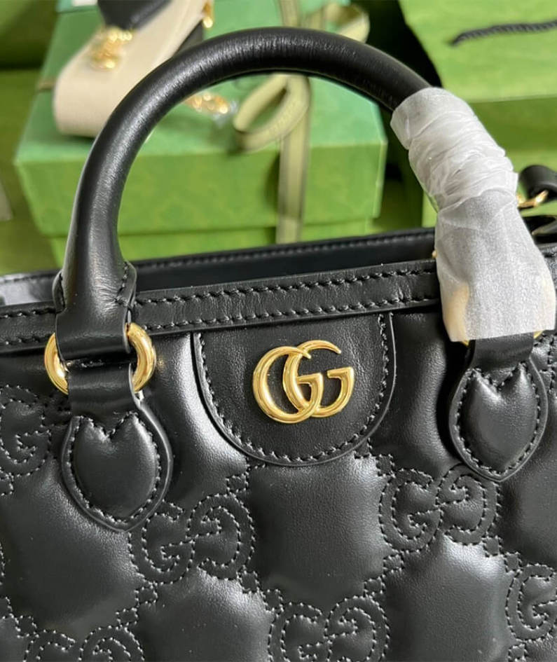 GG matelassé mini top handle bag