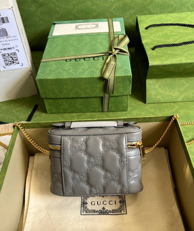 GG Matelassé top handle mini bag
