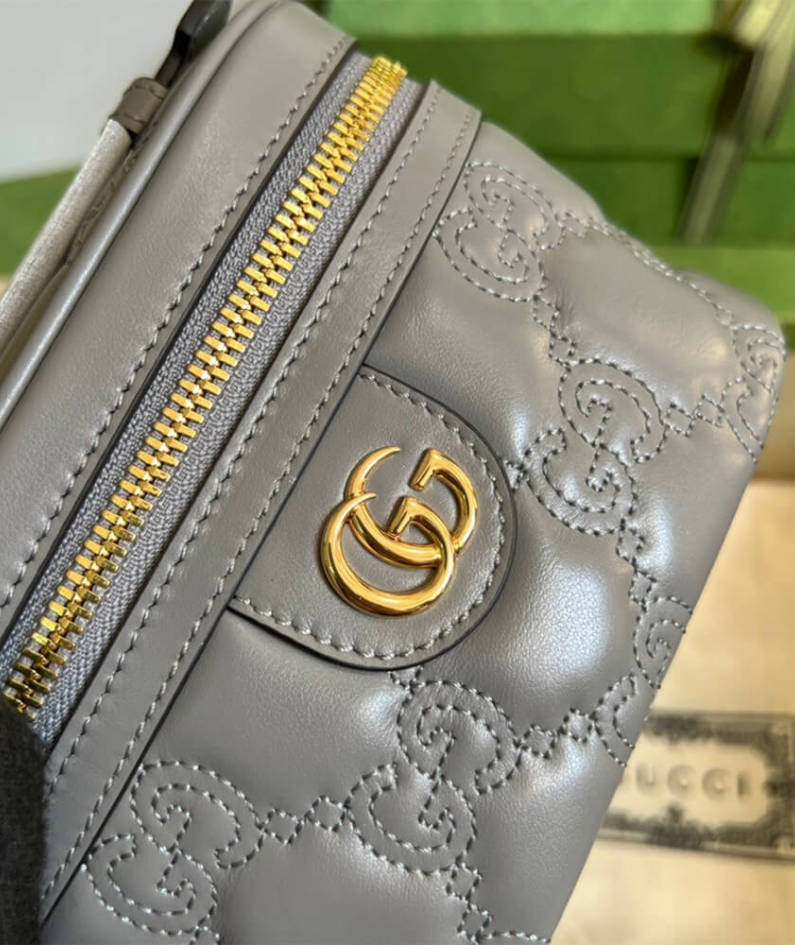 GG Matelassé top handle mini bag