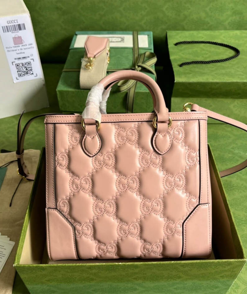 GG matelassé mini top handle bag