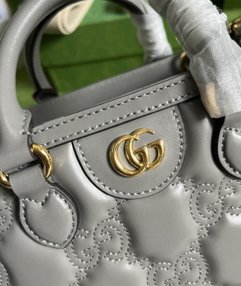 GG matelassé mini top handle bag