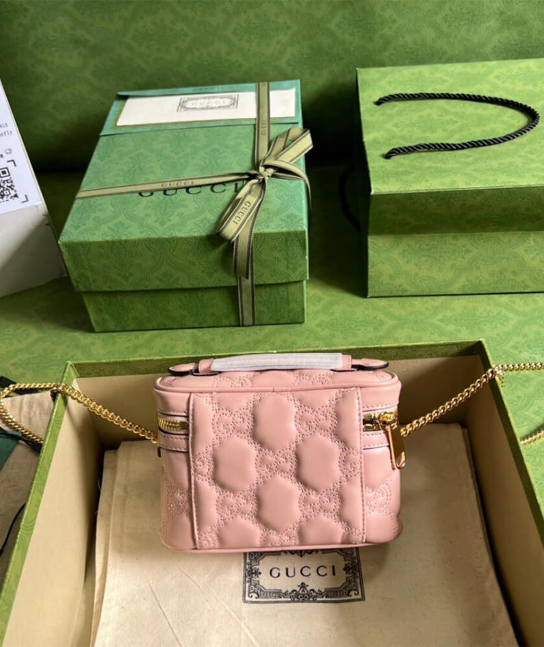 GG Matelassé top handle mini bag