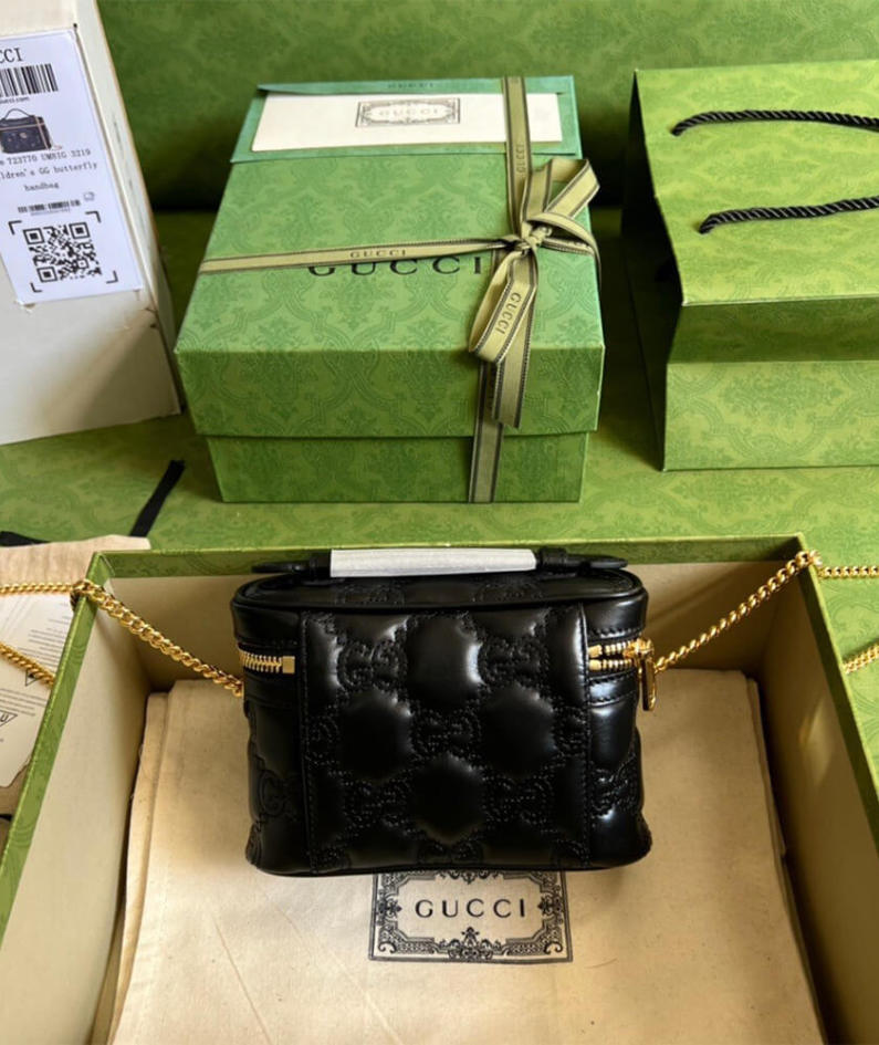 GG Matelassé top handle mini bag